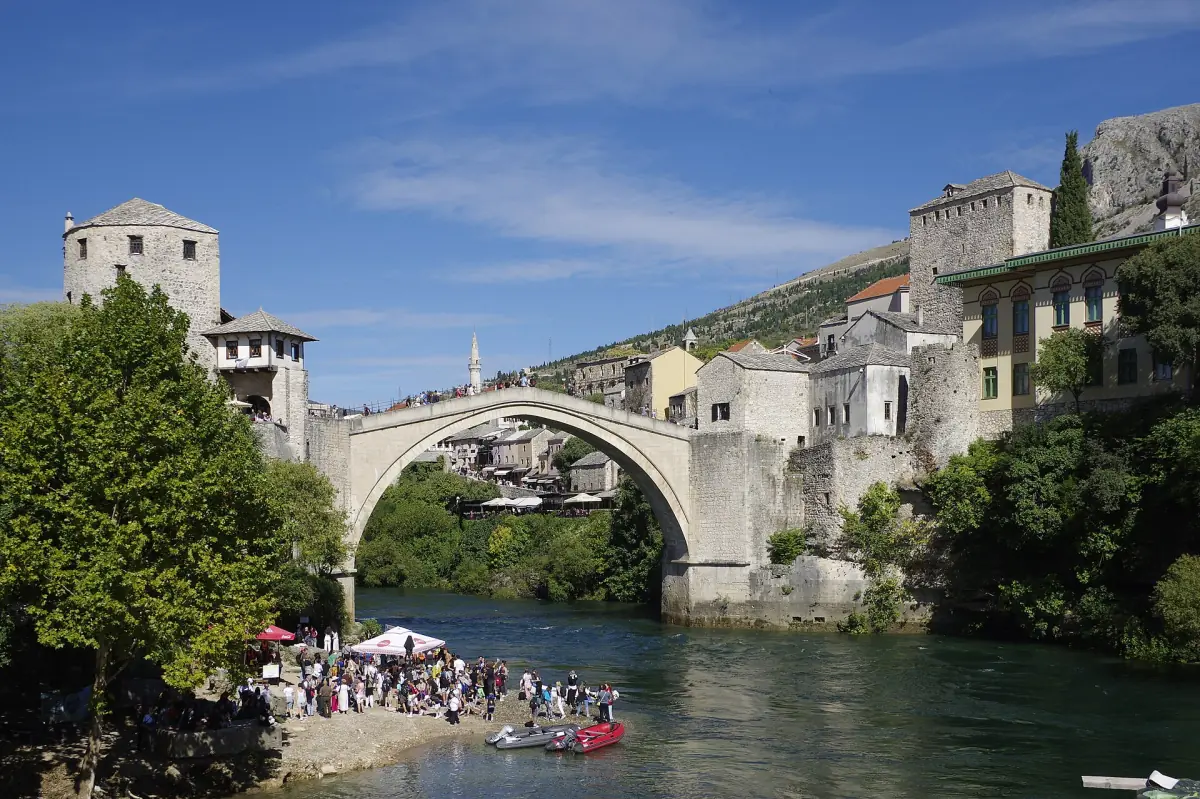 Stari Most with visitors on the river beach below